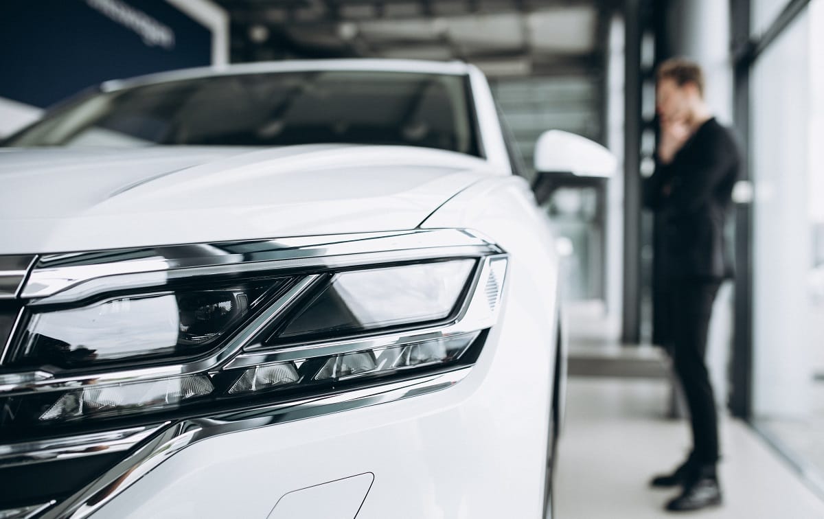 Man inspecting a car and making a decision