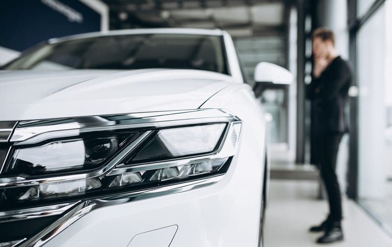 Man inspecting a car and making a decision