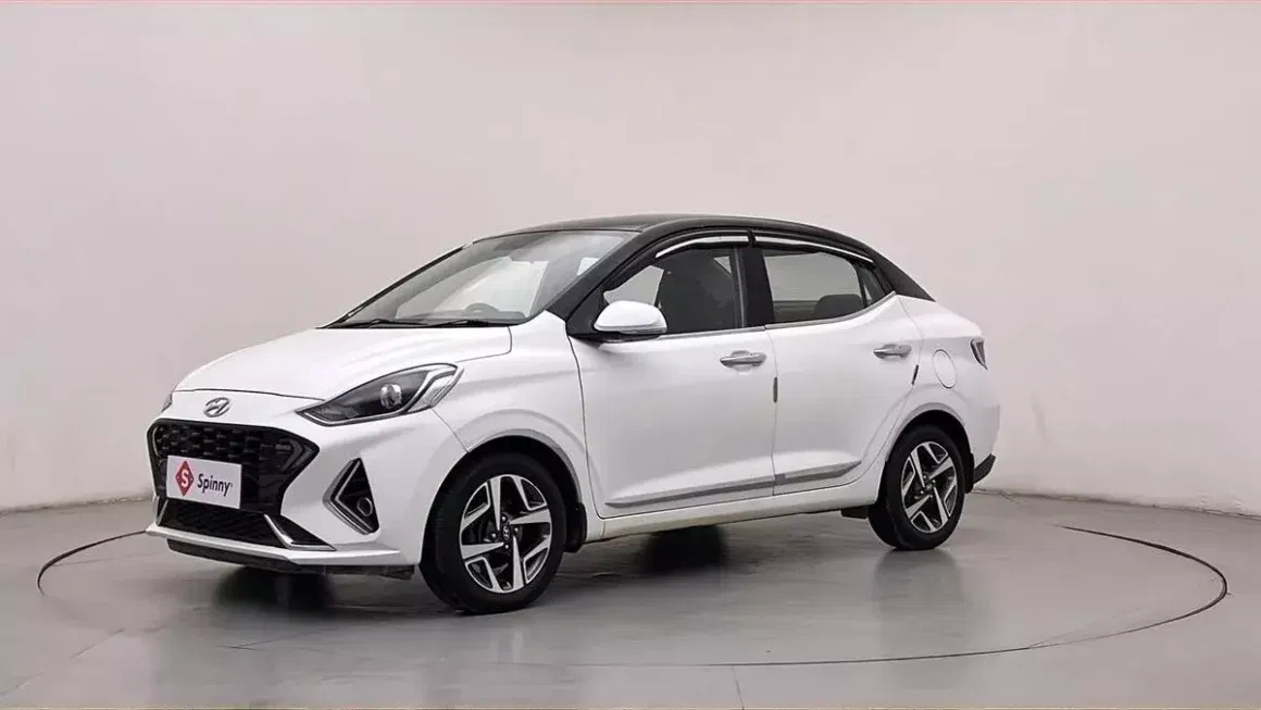 Spinny Assured used Hyundai Aura turbo white