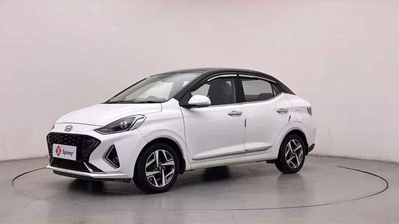Spinny Assured used Hyundai Aura turbo white